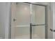Modern walk-in shower features sleek glass doors and white subway tile at 1950 Black Oak Dr, Shelbyville, IN 46176