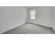 Bedroom featuring neutral carpet, a window and a door at 1951 Black Oak Dr, Shelbyville, IN 46176