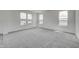 Bedroom featuring neutral carpet and three windows at 1951 Black Oak Dr, Shelbyville, IN 46176