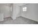 Bonus room with gray carpet, white walls and natural lighting at 1951 Black Oak Dr, Shelbyville, IN 46176