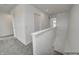 Hallway leading to bedrooms with gray carpet and white walls at 1951 Black Oak Dr, Shelbyville, IN 46176