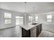 Island kitchen with stainless steel sink, bar seating, and open space at 1951 Black Oak Dr, Shelbyville, IN 46176