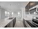 Modern kitchen with stainless steel appliances and marble countertops at 1951 Black Oak Dr, Shelbyville, IN 46176