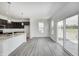 Open-concept living area with hardwood floors and natural light at 1951 Black Oak Dr, Shelbyville, IN 46176
