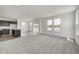 Spacious living room with large windows and gray carpeting at 1951 Black Oak Dr, Shelbyville, IN 46176