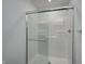 Glass shower with silver frame and a hand bar for assistance at 1951 Black Oak Dr, Shelbyville, IN 46176