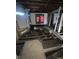 Unfinished interior with exposed floor joists, framed walls, and natural light, offering potential for renovation at 21 S Warman Ave, Indianapolis, IN 46222