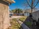 Spacious backyard featuring a concrete pad, storage shed, and mature trees at 2333 Villa Ave, Indianapolis, IN 46203