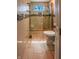 Modern bathroom featuring glass shower, tiled walls, and sleek fixtures at 2333 Villa Ave, Indianapolis, IN 46203