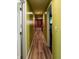 Bright hallway with wood floors connects various rooms of the house at 2333 Villa Ave, Indianapolis, IN 46203