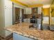 Modern kitchen with stainless steel appliances, granite countertops, and mosaic backsplash at 2333 Villa Ave, Indianapolis, IN 46203