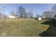 Spacious backyard enclosed by a wooden fence, featuring an additional storage shed at 250 Three Notch Ln, Bargersville, IN 46106