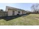 Backyard featuring a large lawn, patio, and wooden fence at 250 Three Notch Ln, Bargersville, IN 46106