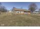 Picture of charming brick house from the side angle showing a large yard at 250 Three Notch Ln, Bargersville, IN 46106