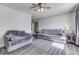 Cozy living room with modern gray sofas and dark hard wood flooring at 250 Three Notch Ln, Bargersville, IN 46106