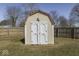 Backyard storage shed with double doors, providing extra space for tools and equipment at 250 Three Notch Ln, Bargersville, IN 46106