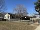 View of home with a fenced in front yard and mature trees at 251 S 12Th Ave, Beech Grove, IN 46107