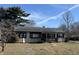 Charming single-story home with a well-maintained lawn and mature trees on a partly sunny day at 251 S 12Th Ave, Beech Grove, IN 46107