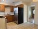 Kitchen with stainless steel refrigerator and wooden cabinets at 251 S 12Th Ave, Beech Grove, IN 46107
