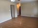 Living room featuring hardwood floors, neutral walls, and doorway at 251 S 12Th Ave, Beech Grove, IN 46107