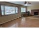 Spacious living room featuring a brick fireplace and hardwood floors and bay window at 251 S 12Th Ave, Beech Grove, IN 46107
