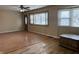 Bright living room with hardwood floors, a ceiling fan and a large window at 251 S 12Th Ave, Beech Grove, IN 46107