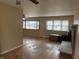 Inviting living room with hardwood floors and natural light from large windows at 251 S 12Th Ave, Beech Grove, IN 46107