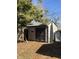 Backyard shed with a pair of wooden doors at 251 S 12Th Ave, Beech Grove, IN 46107