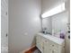Clean bathroom vanity with granite countertop, bright lighting, and convenient storage space at 2552 Spring Hill Ct, Indianapolis, IN 46268