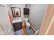 Bathroom with updated vanity, mirror, and fixtures. Features wood look floors and a toilet at 2552 Spring Hill Ct, Indianapolis, IN 46268
