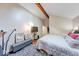 Primary bedroom with vaulted ceilings and wood-look floors has a tv and room for seating at 2552 Spring Hill Ct, Indianapolis, IN 46268
