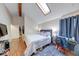 Bedroom features wood-look flooring, a skylight, and ample space at 2552 Spring Hill Ct, Indianapolis, IN 46268