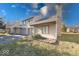 Charming condo with attached garage and front yard is surrounded by green grass and mature trees at 2552 Spring Hill Ct, Indianapolis, IN 46268
