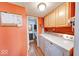 The Laundry room features a utility sink, washer and dryer hookups, and access to half bathroom at 2552 Spring Hill Ct, Indianapolis, IN 46268