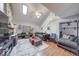 Bright living room boasts high ceilings, a stone fireplace, hardwood floors, and plenty of natural light at 2552 Spring Hill Ct, Indianapolis, IN 46268