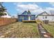 Backyard view of home showing fresh paint and a new wooden deck and stairs at 2626 E 18Th St, Indianapolis, IN 46218