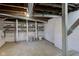 Unfinished basement with concrete floor, exposed ductwork, and shelving for storage at 2626 E 18Th St, Indianapolis, IN 46218