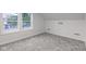 Bedroom with neutral walls, carpet, and a window offering natural light at 2626 E 18Th St, Indianapolis, IN 46218