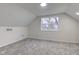 Cozy bedroom with a large window, neutral walls, and carpeted floors at 2626 E 18Th St, Indianapolis, IN 46218