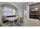 Dining room featuring a built-in bench, a modern table, and an arched window at 2626 E 18Th St, Indianapolis, IN 46218
