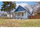 Charming renovated home featuring a covered porch with updated railings and a fresh blue and gray color scheme at 2626 E 18Th St, Indianapolis, IN 46218