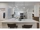 Well-lit kitchen featuring pendant lighting, stainless steel appliances, and a quartz countertop at 2626 E 18Th St, Indianapolis, IN 46218