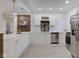 Modern kitchen featuring quartz countertops, stainless steel appliances, and light wood flooring at 2626 E 18Th St, Indianapolis, IN 46218