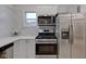 Close-up of a modern kitchen with stainless steel appliances and quartz countertops at 2626 E 18Th St, Indianapolis, IN 46218