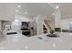Open kitchen with modern appliances, white cabinetry, quartz countertops, and stylish pendant lights at 2626 E 18Th St, Indianapolis, IN 46218