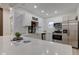Bright kitchen featuring marble backsplash, stainless steel appliances, and quartz countertops at 2626 E 18Th St, Indianapolis, IN 46218