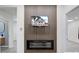 Modern living room showcasing the fireplace and mounted TV on a wood accent wall at 2626 E 18Th St, Indianapolis, IN 46218