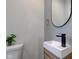 Elegant powder room featuring sleek fixtures and neutral wall coloring at 2626 E 18Th St, Indianapolis, IN 46218