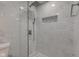 Luxurious walk-in shower features elegant tile work, rainfall shower head, and storage niche at 2626 E 18Th St, Indianapolis, IN 46218