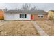Cozy home featuring a bright red front door and attached one car garage at 2714 Manlove Ave, Indianapolis, IN 46218